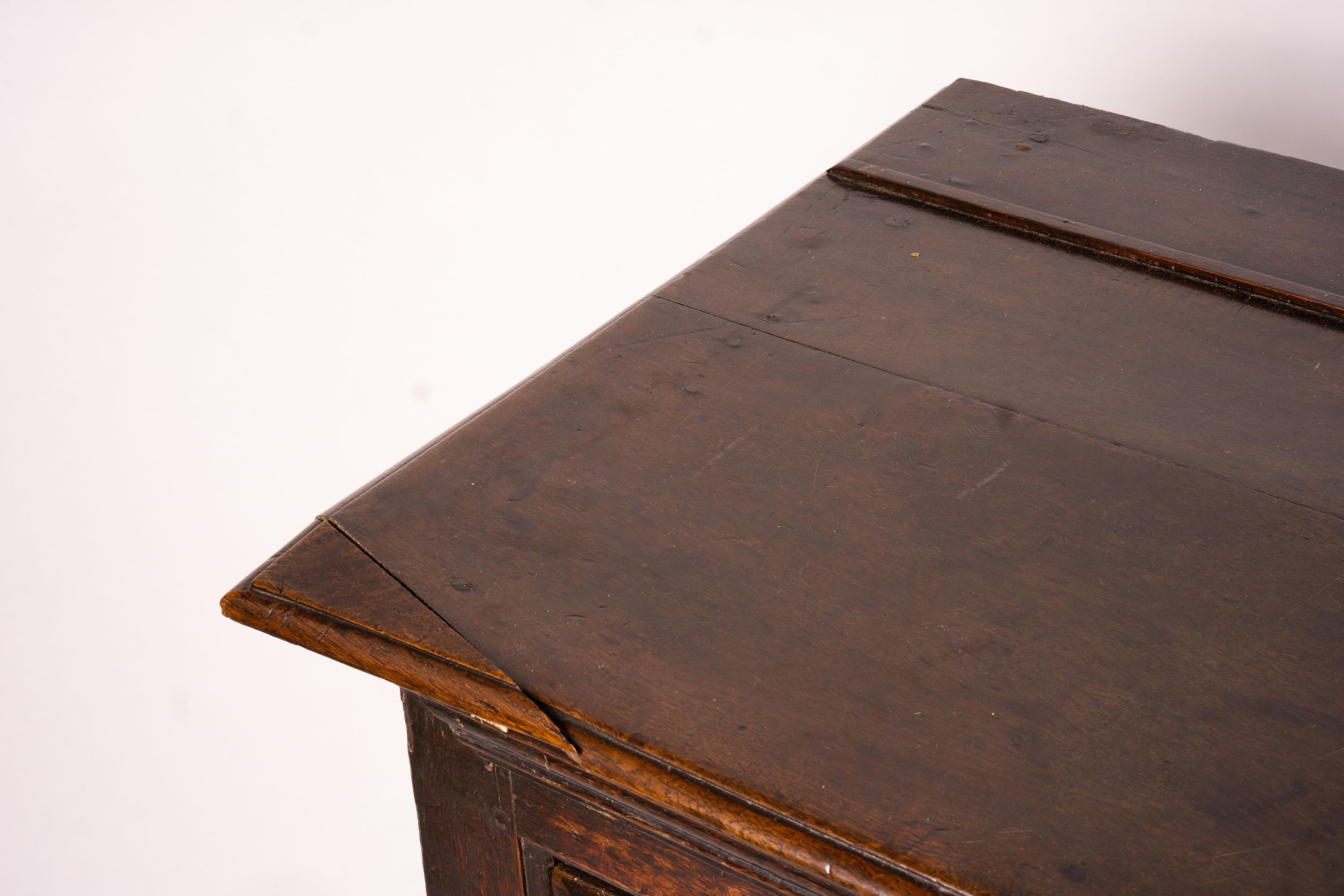 An 18th century oak low dresser on pole turned legs and pad feet, length 198cm, depth 53cm, height 88cm